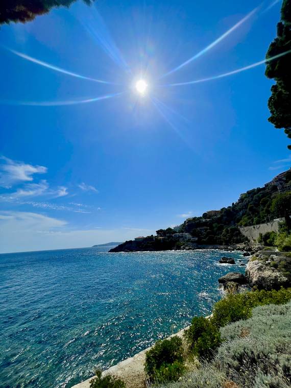 Sunlit Mediterranean coastline on the Cote d'Azur, France