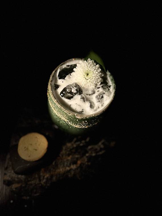 A cocktail garnished with a white flower in Medellin, Colombia