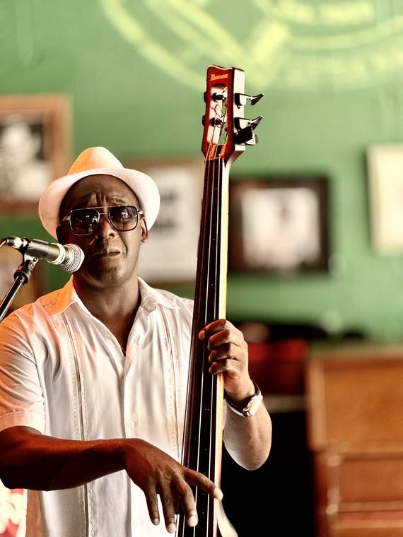 A musician playing an upright double bass in Miami, Florida